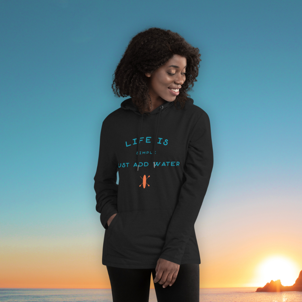Woman in black hoodie with sunset background